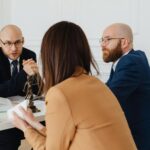 Business owners meeting with employment lawyers to discuss costly employment law mistakes affecting companies