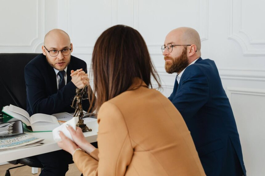 Business owners meeting with employment lawyers to discuss costly employment law mistakes affecting companies