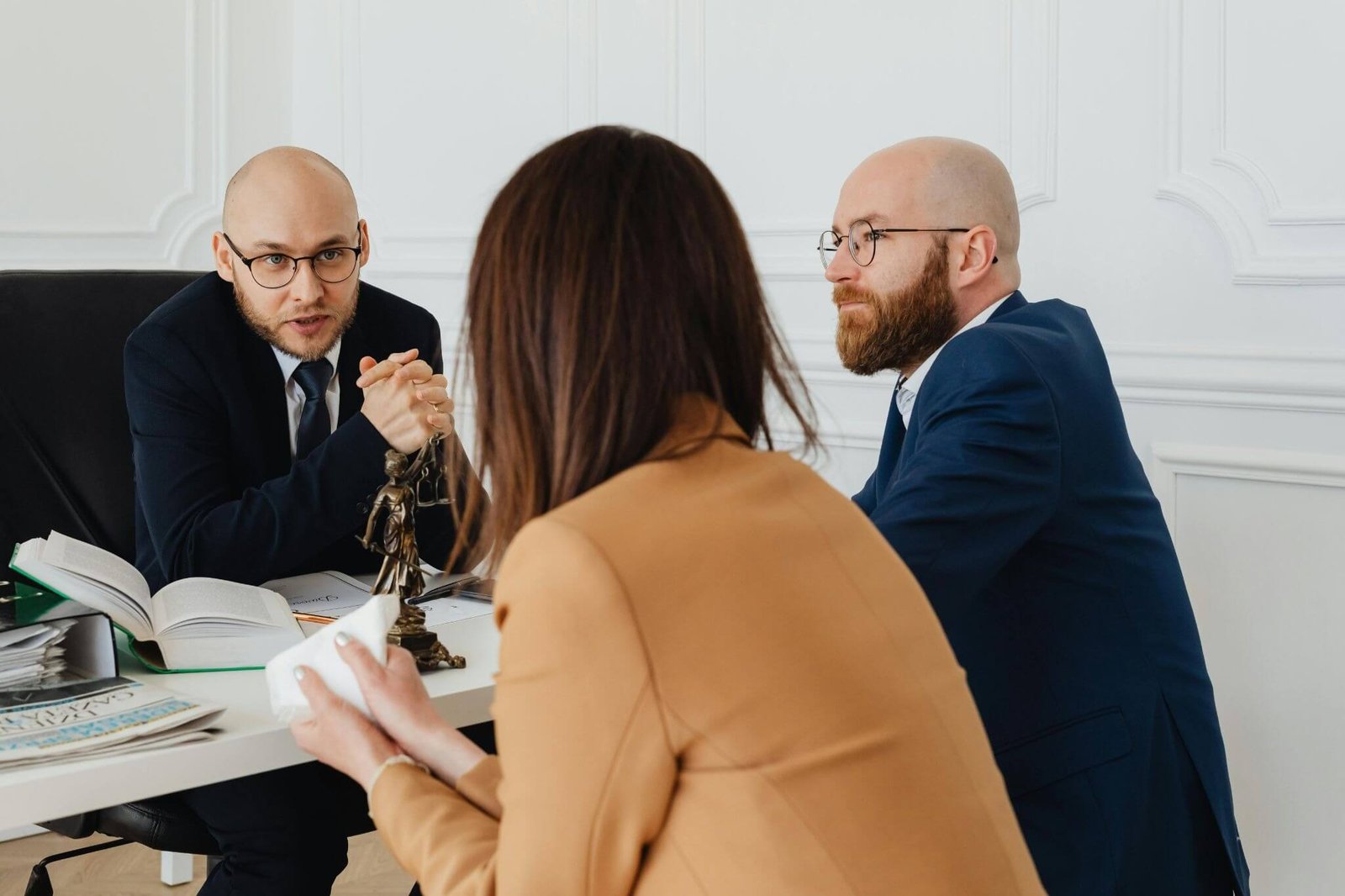 Business owners meeting with employment lawyers to discuss costly employment law mistakes affecting companies